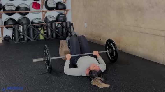 Barbell Feet Elevated Staggered Glute Bridge