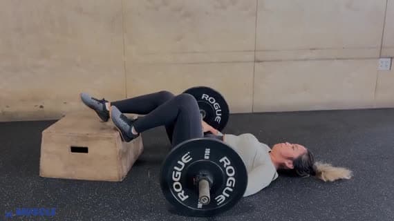 Barbell Feet Elevated Staggered Glute Bridge