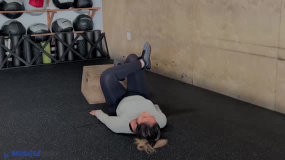 Bodyweight Feet Elevated Figure Four Glute Bridge