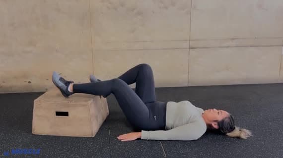Bodyweight Feet Elevated Staggered Glute Bridge