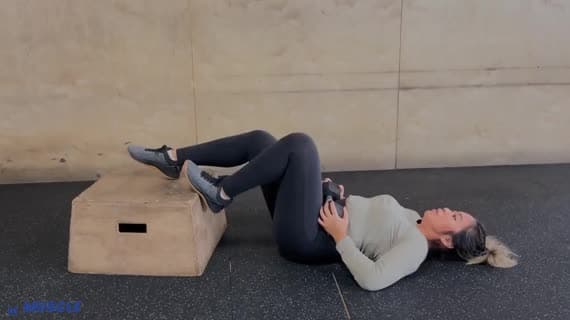 Dumbbell Feet Elevated Staggered Glute Bridge