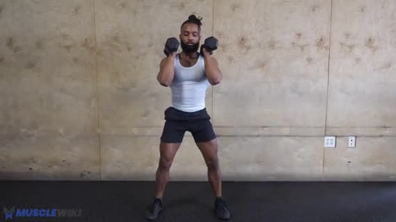 Squat con manubri in front rack con pausa