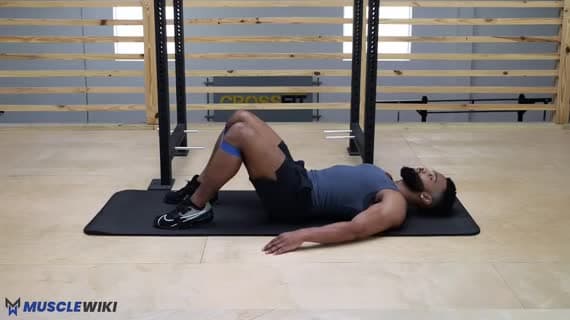 Ponte per i glutei da sdraiati con abduzione con miniband