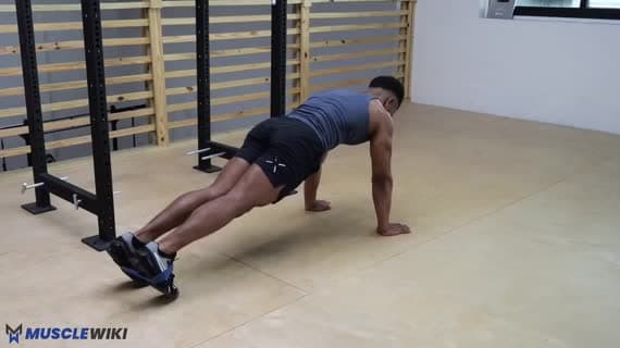 Plank con step out con miniband