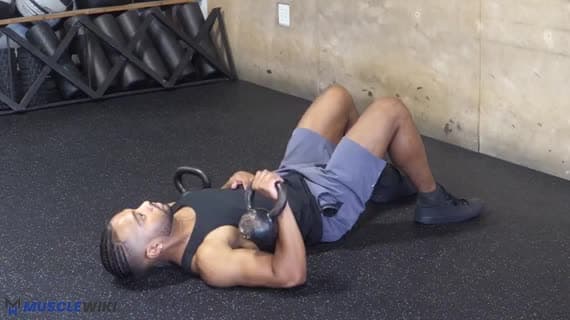 Kettlebell Press com um braço no chão