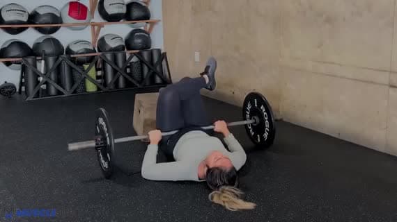 Barbell Feet Elevated Figure Four Glute Bridge