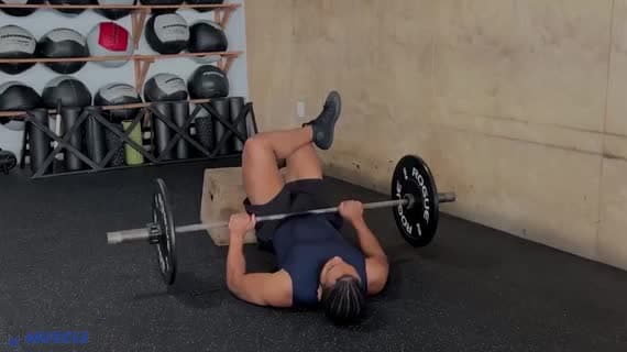 Barbell Feet Elevated Figure Four Glute Bridge